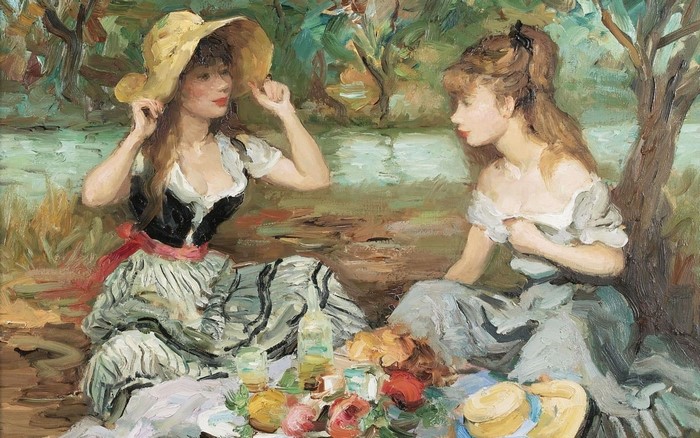 Two women having a picnic by the water