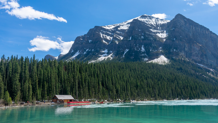 Lake Louise with Mountains, Forest, and Boathouse