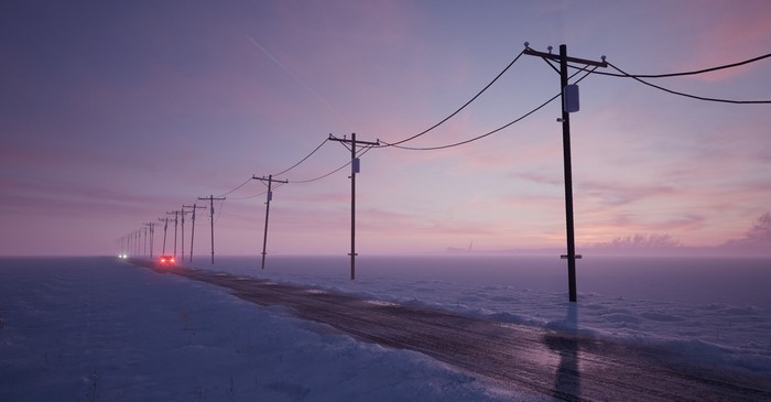Cars on a snowy road with power lines at dusk