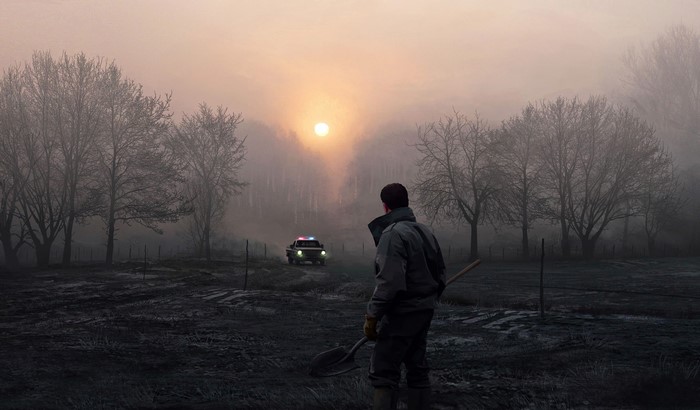 Man with shovel and police car in misty sunrise field