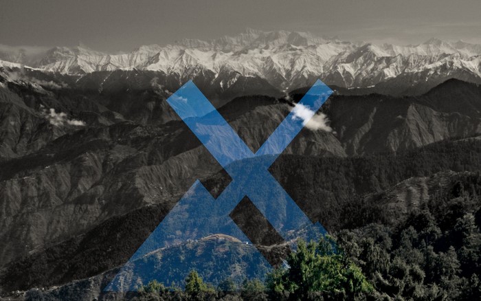 MXLinux logo over snowy mountains