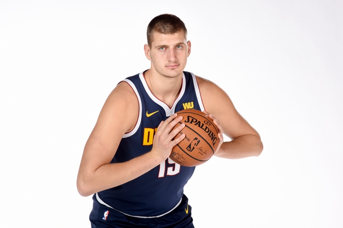 Nikola Jokic of the Denver Nuggets holding a Spalding basketball
