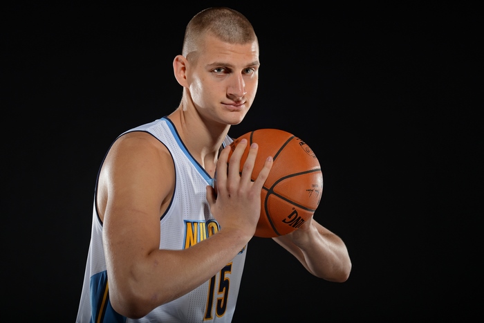 Nikola Jokic of the Denver Nuggets holding a basketball