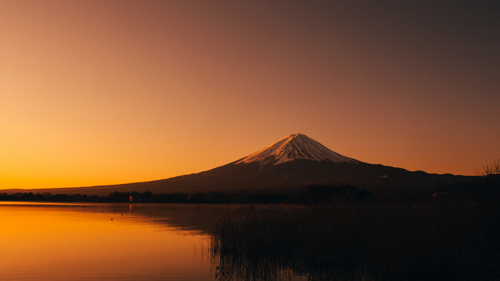Mount Fuji at sunset over a lake in Japan