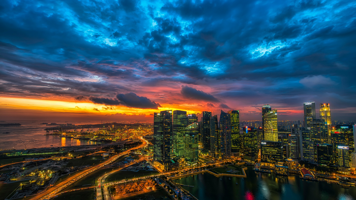 Singapore cityscape at sunset with dramatic clouds
