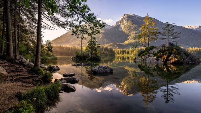4K lake with mountains and trees reflection
