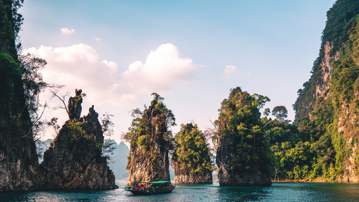 Boat tour among limestone karsts in Thailand