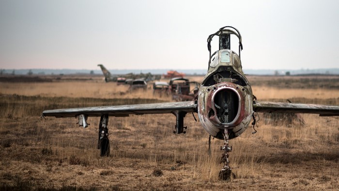 4K wreck of an aircraft in a field