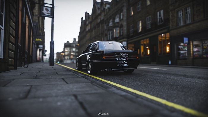 Black BMW 325i on a city street