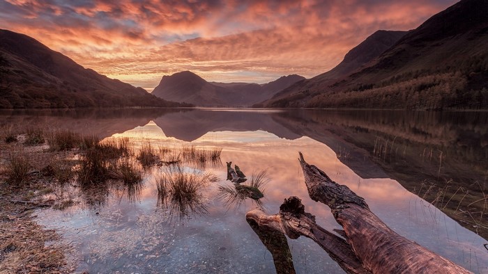 Lake and mountains at sunset with reflection