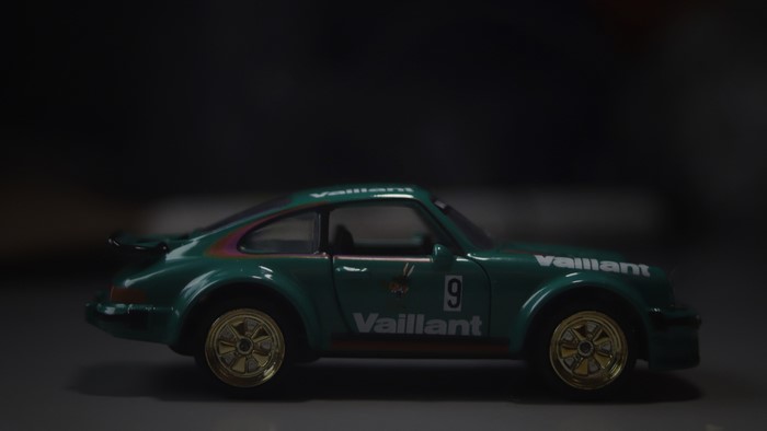 Green Porsche 911 toy car with Vaillant livery