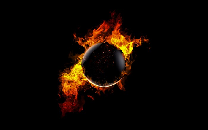 Sphere engulfed in flames on a black background