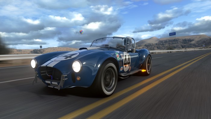 Blue Shelby Cobra vintage car on a road