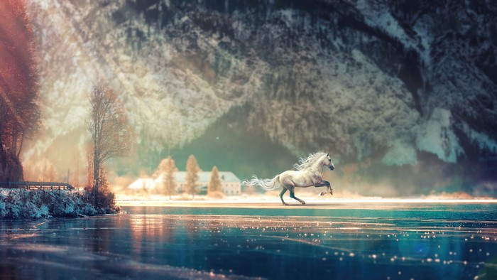 White horse running on a frozen lake with mountains