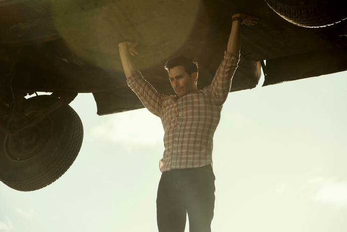 Tyler Hoechlin as Superman holding up a vehicle