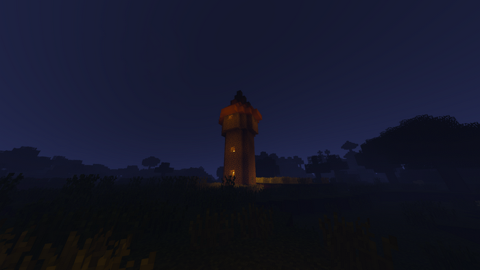 Minecraft tower at night with fire