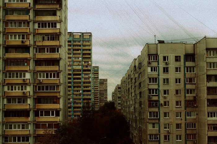 Apartment buildings in a city with overhead wires