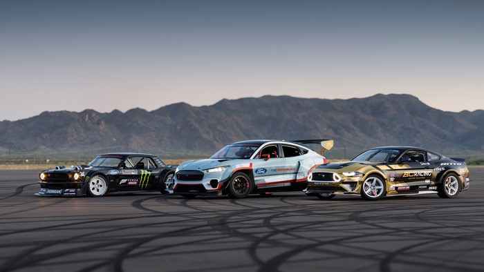 Ford Mustang Mach-E and Mustangs on asphalt