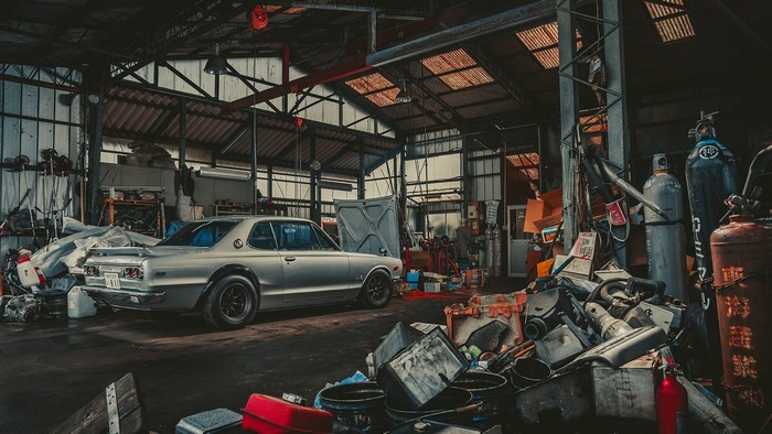 Nissan Skyline C10 Hakosuka in a cluttered garage