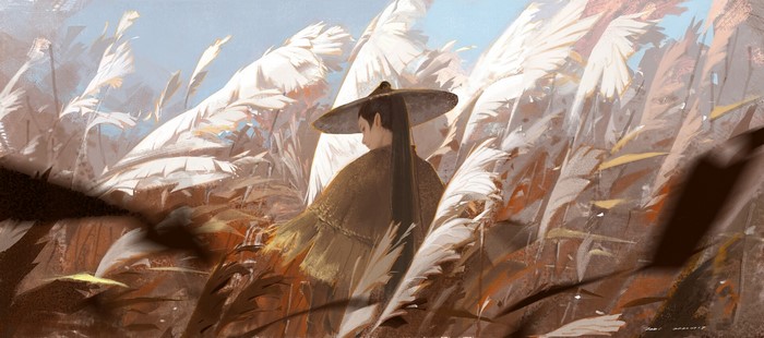 Woman in straw hat in tall grass