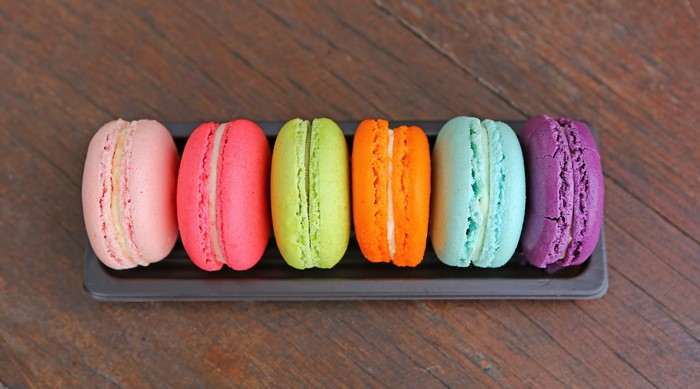 Colorful macarons on a wooden table