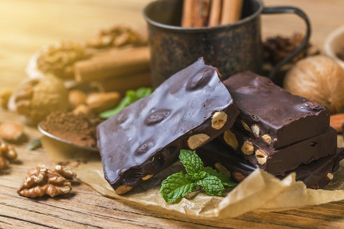 Chocolate bars with nuts and mint leaves