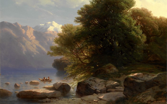 A boat on a lake with mountains and trees