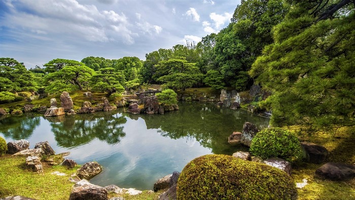 Japanese garden with a pond and trees in Kyoto