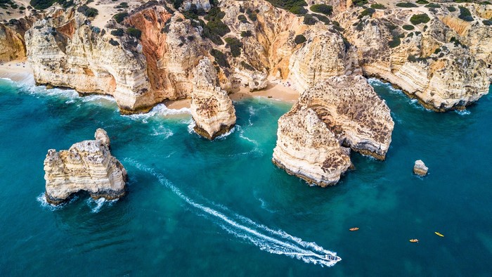 Scenic Algarve Coastline with Limestone Cliffs and Boat