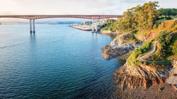 Bridge over a bay with a coastal path