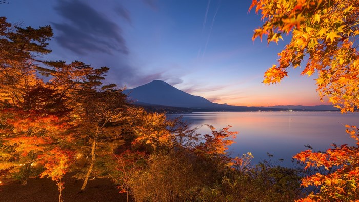Mount Fuji and Lake Yamanaka at sunset with autumn trees