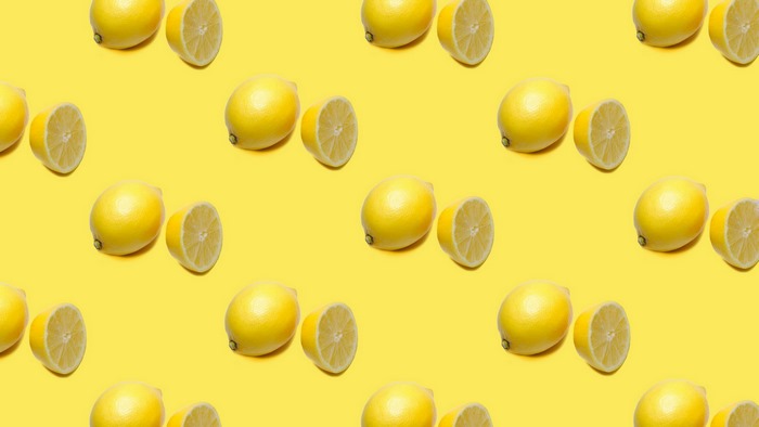 Pattern of Lemons on Yellow Background