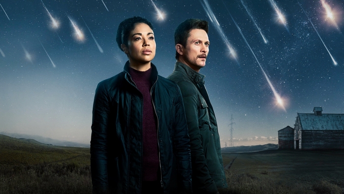 Riann Steele and Jonathan Tucker under meteor shower