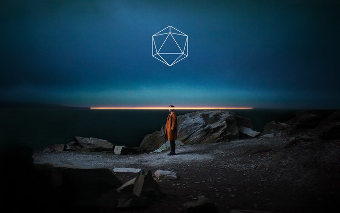 Odesza geometric figure and person at dusk