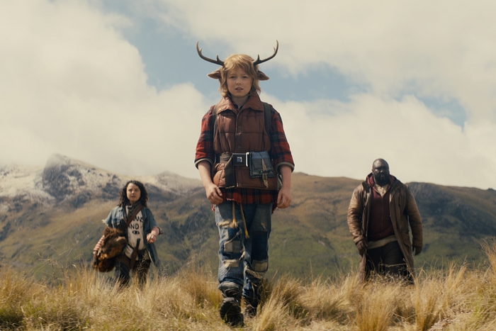 Gus, Tommy Jepperd, and a girl in a field