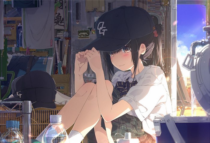 Anime girl in baseball cap holding knees