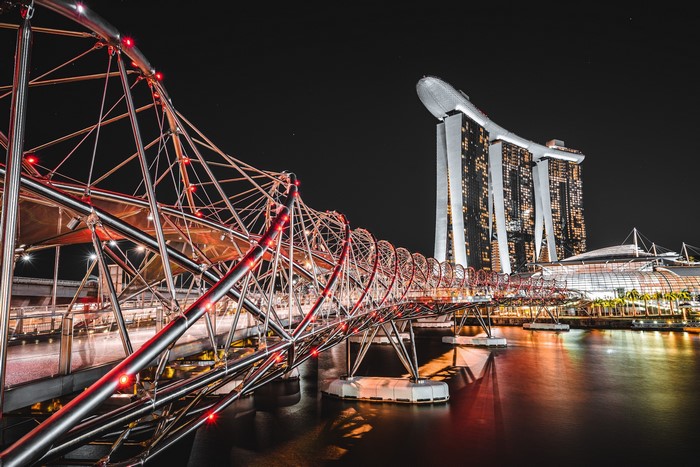 Helix Bridge and Marina Bay Sands at night in Singapore