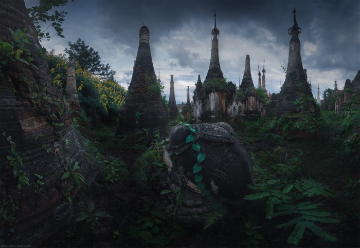 Overgrown ancient stupas and ruins in Myanmar