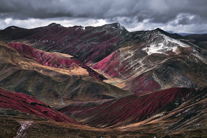 Rainbow Mountains in Peru under a cloudy sky