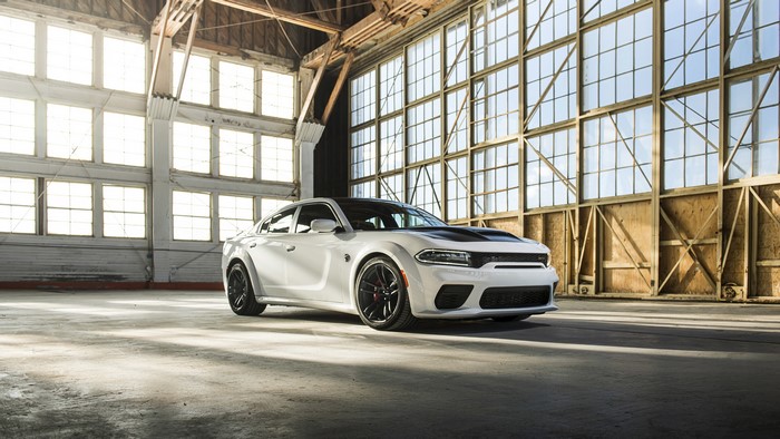 White Dodge Charger Hellcat in a hangar