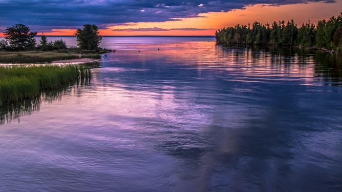 Lake Superior sunset with trees and clouds