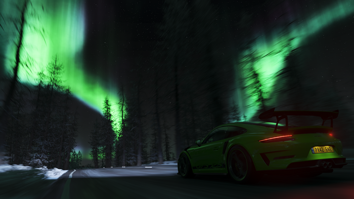 Green Porsche 911 driving under Aurora Borealis in Forza Horizon 4