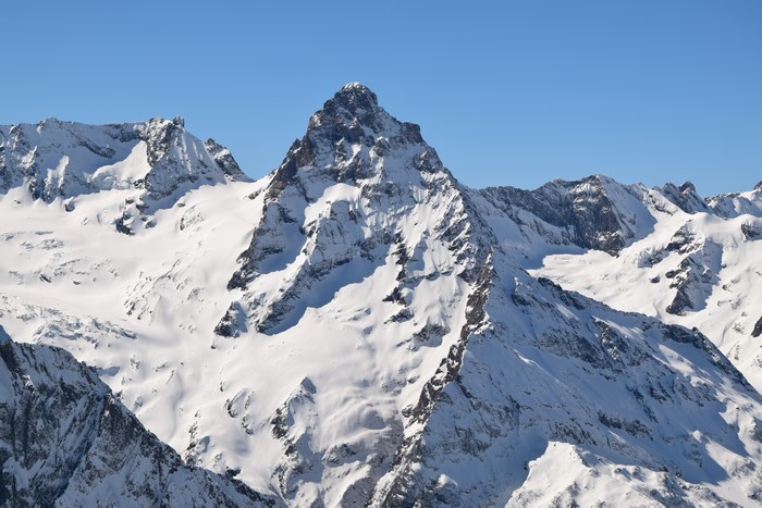 4K snow-covered mountains under clear sky