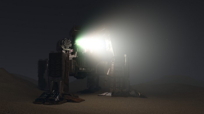 Giant robot with spotlight in desert at night
