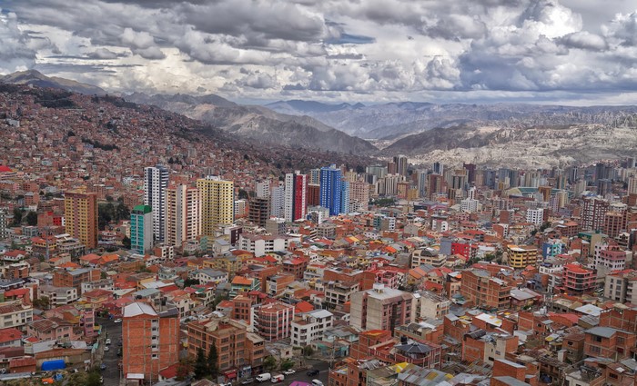 Cityscape of La Paz, Bolivia with mountains and clouds