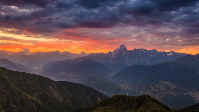 Caucasus Mountains at Sunset with Dramatic Clouds