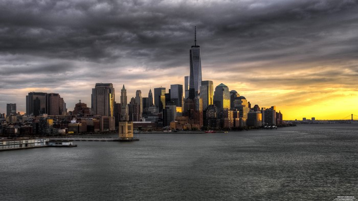 New York City skyline at sunset with storm clouds
