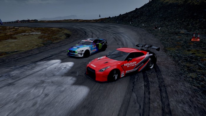 Nissan GT-R and Ford Mustang drift on a race track