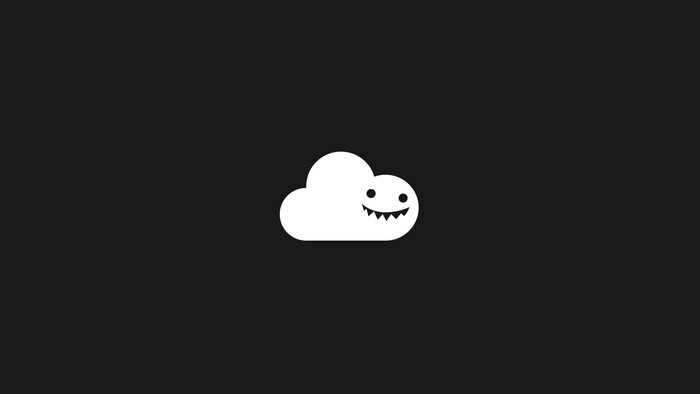 White cloud with a monster face on a black background