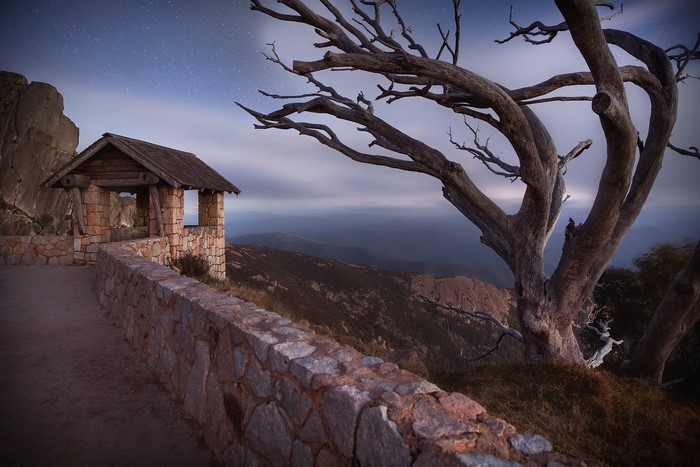 Stone shelter and dead tree on Mount Buffalo, Australia